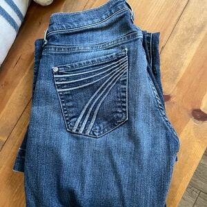 7 For All Mankind Dark Blue Flare Jeans with Curved Pocket Stitching